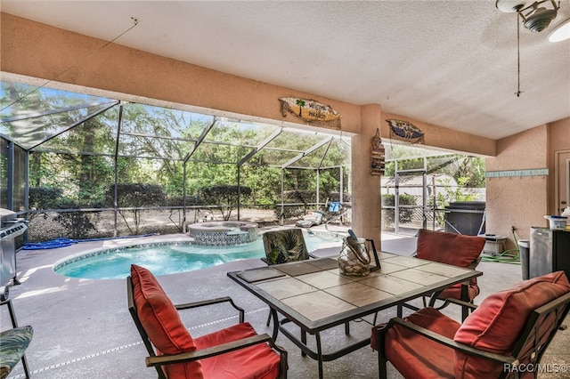 7690 N Greendale Dr, Citrus Springs, FL 34434 - view of pool featuring a patio area, a pool with connected hot tub, and glass enclosure