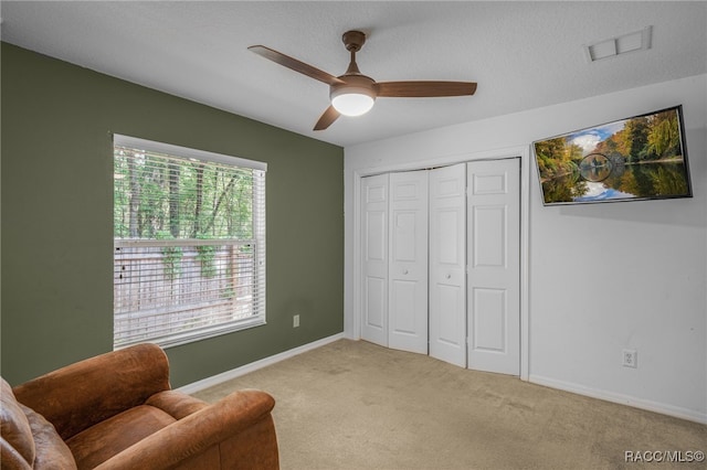 7690 N Greendale Dr, Citrus Springs, FL 34434 - sitting room with a ceiling fan, carpet flooring, and baseboards