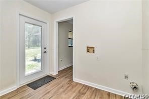 entryway with light hardwood / wood-style floors