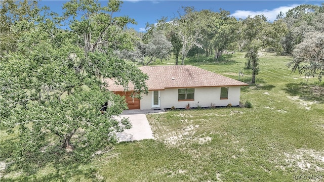 single story home with a front yard