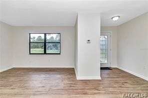 empty room with hardwood / wood-style floors