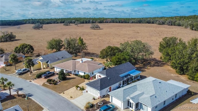 birds eye view of property with a rural view