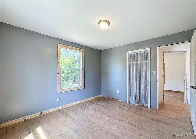 unfurnished room featuring light hardwood / wood-style flooring