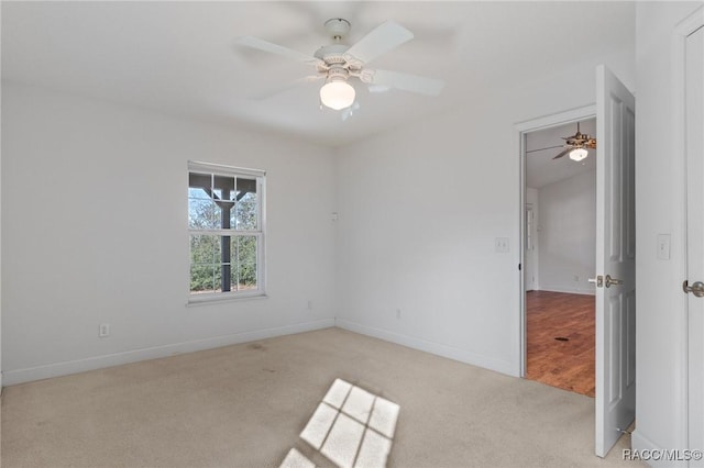 carpeted empty room with ceiling fan