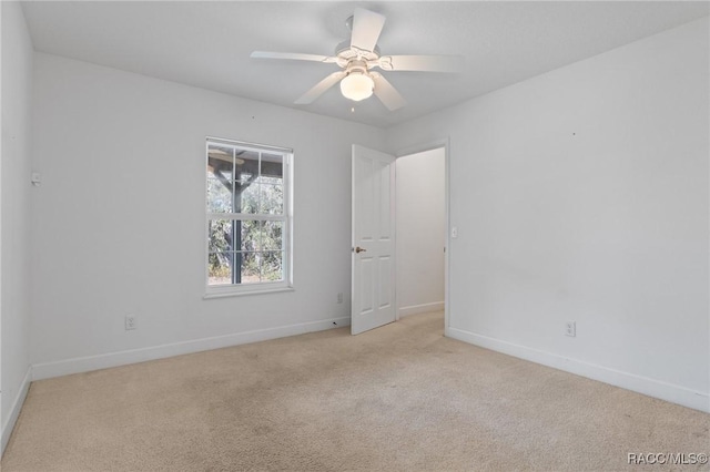 carpeted empty room with ceiling fan