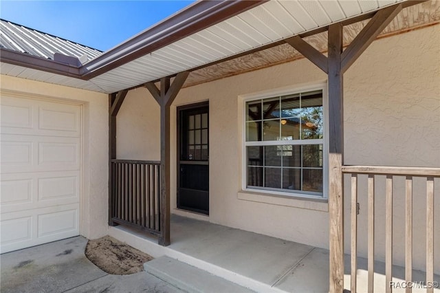 entrance to property featuring a garage