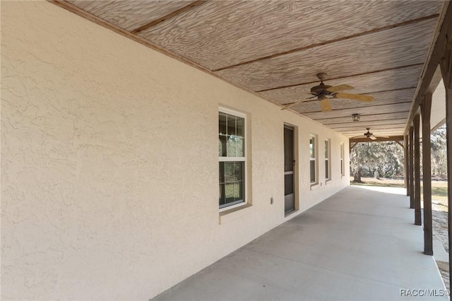 view of patio featuring ceiling fan