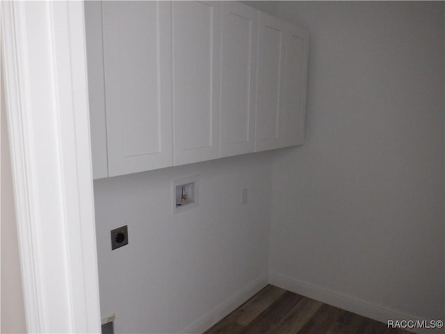 laundry area featuring cabinets, hookup for a washing machine, hookup for an electric dryer, and dark hardwood / wood-style flooring