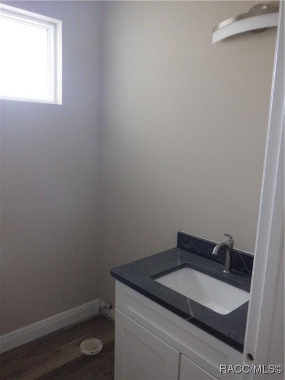 bathroom featuring hardwood / wood-style flooring and vanity