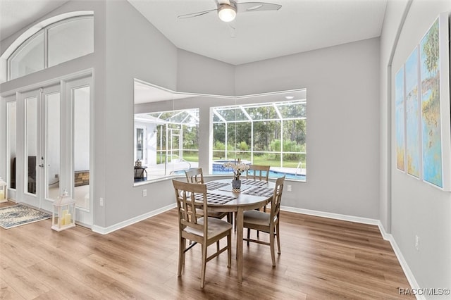 dining space with hardwood / wood-style flooring and ceiling fan