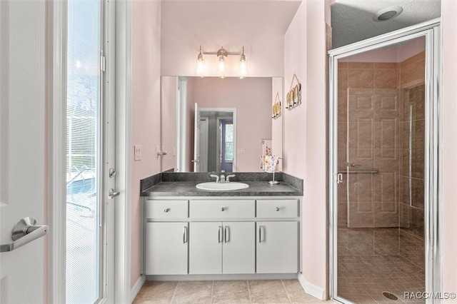 4340 W Mustang Blvd, Beverly Hills, FL 34465 - bathroom with vanity, a shower stall, baseboards, and tile patterned flooring