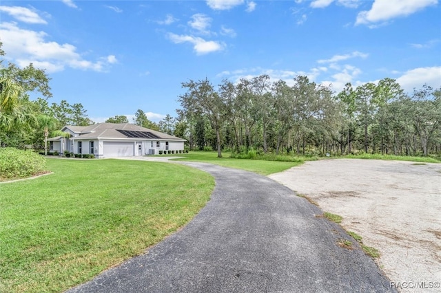 exterior space featuring a front yard and a garage