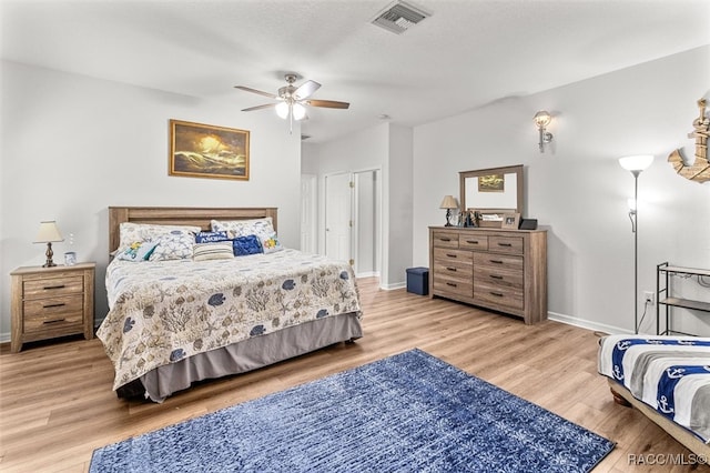 bedroom with ceiling fan and hardwood / wood-style flooring