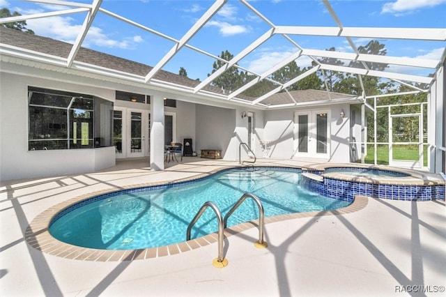 view of pool with glass enclosure, an in ground hot tub, french doors, and a patio