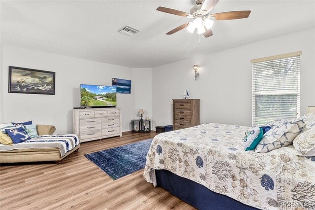 bedroom featuring ceiling fan and wood-type flooring