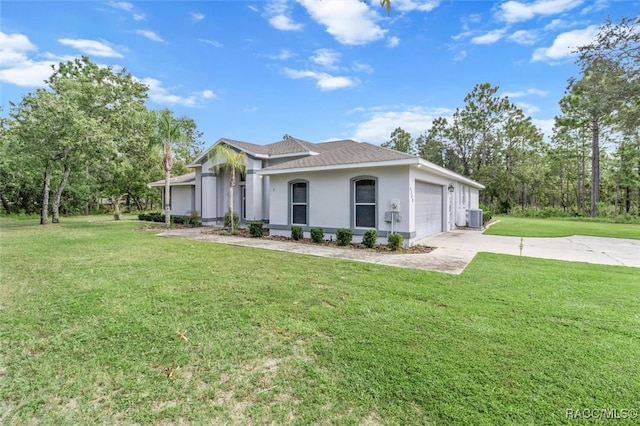 view of home's exterior with a yard, a garage, and central AC unit