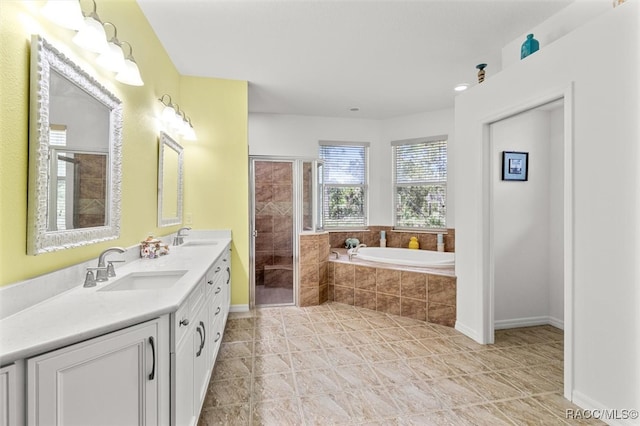 bathroom featuring tile patterned flooring, vanity, and independent shower and bath