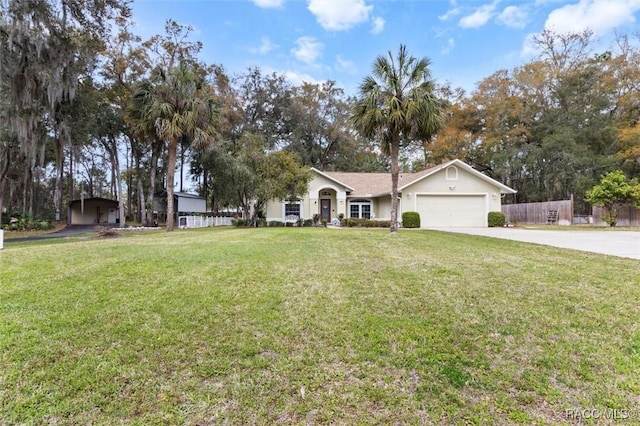 ranch-style house featuring a garage, fence, concrete driveway, and a front yard