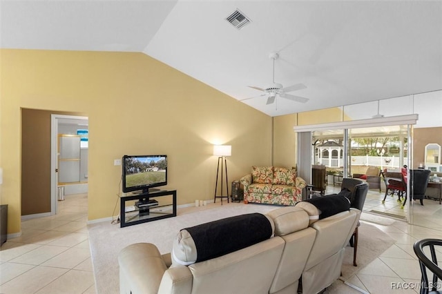 living area with light tile patterned floors, baseboards, visible vents, a ceiling fan, and vaulted ceiling