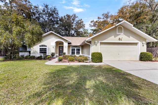 ranch-style home with a garage, driveway, a front lawn, and stucco siding