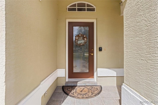 property entrance with stucco siding