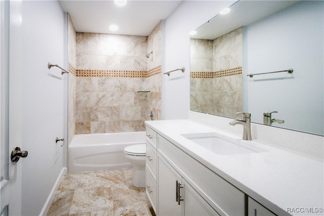 full bathroom featuring toilet, vanity, and tiled shower / bath combo