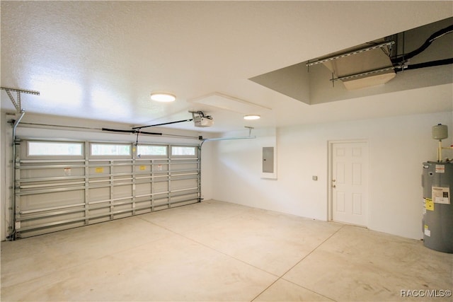 garage featuring a garage door opener, electric panel, and water heater