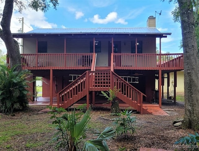 back of property with a deck