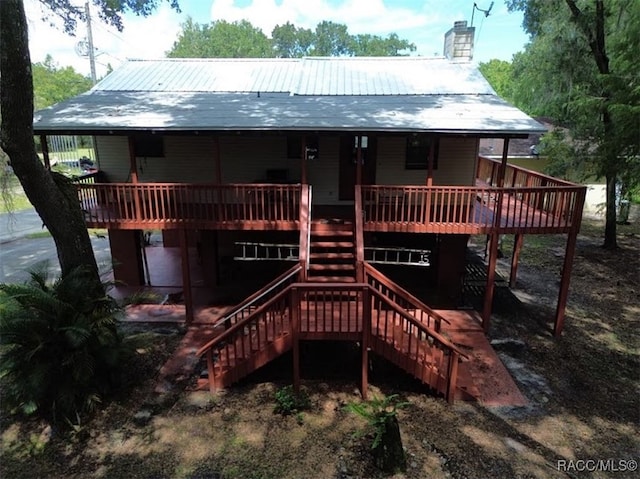 rear view of property with a deck