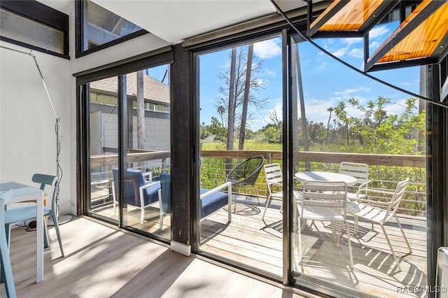 2647 N Seabreeze Pt, Crystal River, FL 34429 - doorway featuring wood finished floors and a wall of windows