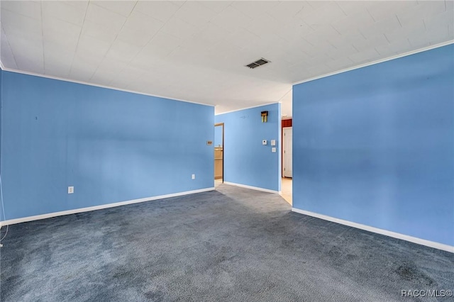 spare room with crown molding and carpet flooring