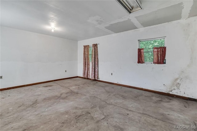 empty room featuring concrete flooring