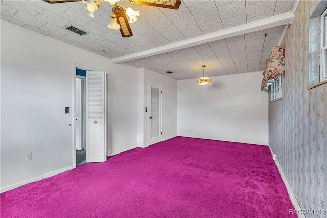 spare room featuring ceiling fan and carpet