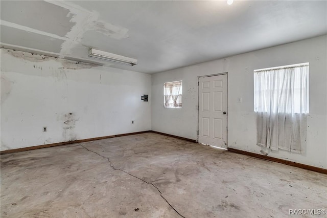 foyer entrance featuring concrete floors