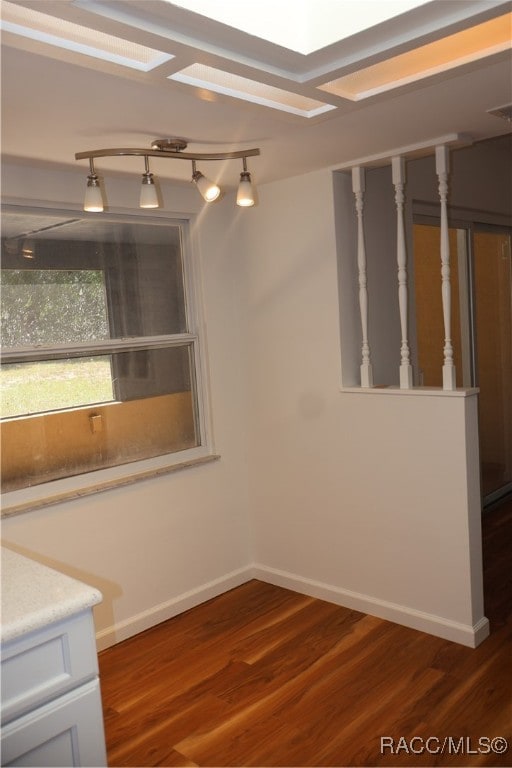 unfurnished dining area featuring dark hardwood / wood-style floors