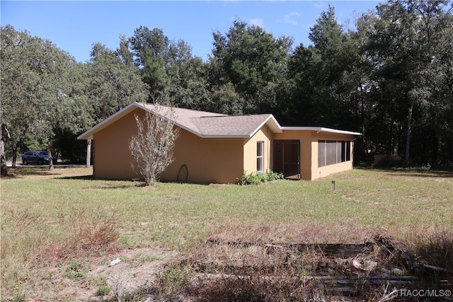 view of property exterior featuring a yard