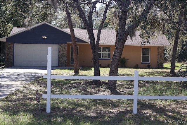 ranch-style house featuring a garage