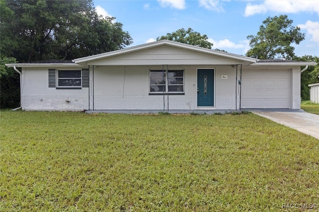 ranch-style home with a front yard and a garage