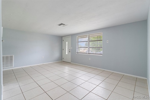 empty room featuring light tile patterned floors