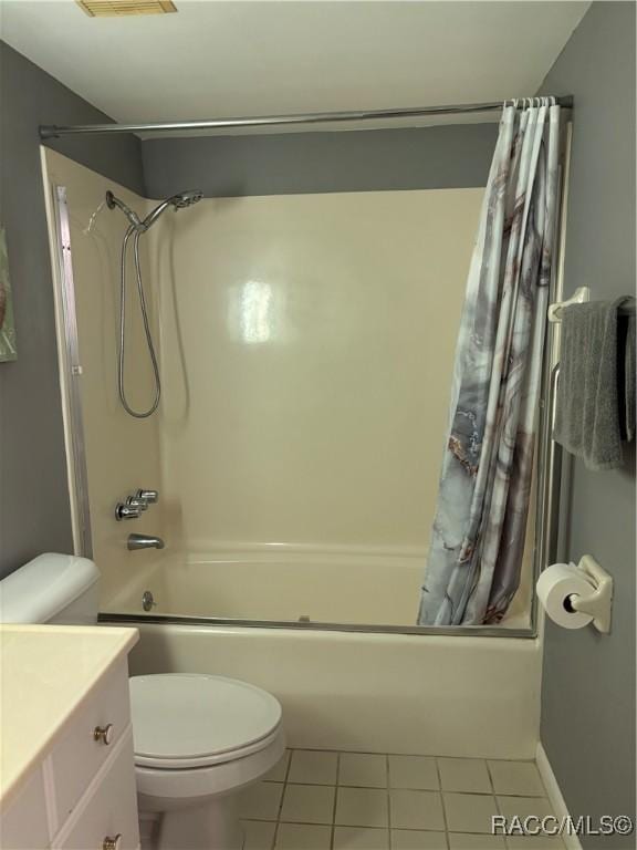 full bathroom with toilet, vanity, shower / bathtub combination with curtain, and tile patterned flooring