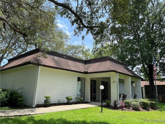 exterior space with a front lawn