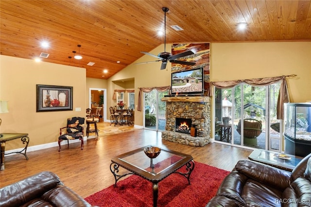 living room with high vaulted ceiling, a stone fireplace, ceiling fan, light wood-type flooring, and wood ceiling