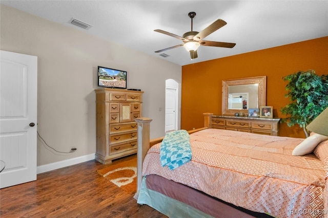 bedroom with ceiling fan and dark wood-type flooring