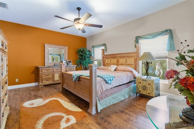 bedroom featuring ceiling fan and dark wood-type flooring