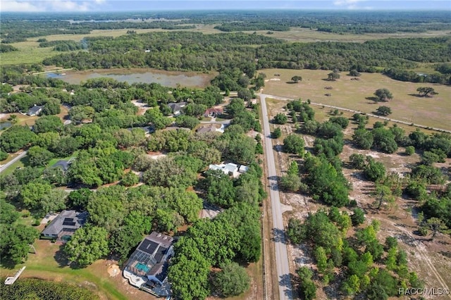 9885 E Lindale Ct, Inverness, FL 34450 - view of property location featuring a heavily wooded area and a nearby body of water