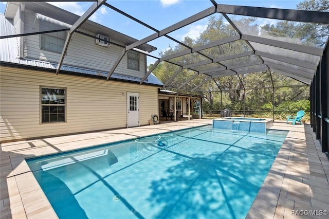 9885 E Lindale Ct, Inverness, FL 34450 - view of pool featuring a pool with connected hot tub, a patio, and glass enclosure