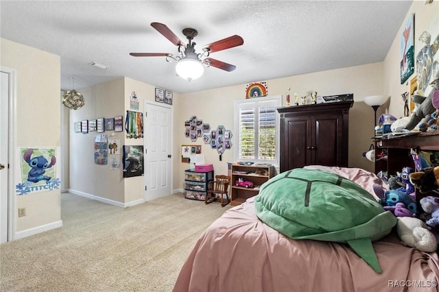9885 E Lindale Ct, Inverness, FL 34450 - bedroom featuring carpet, baseboards, a textured ceiling, and ceiling fan