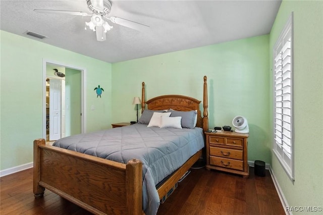 9885 E Lindale Ct, Inverness, FL 34450 - bedroom featuring dark wood-type flooring, baseboards, multiple windows, and ceiling fan