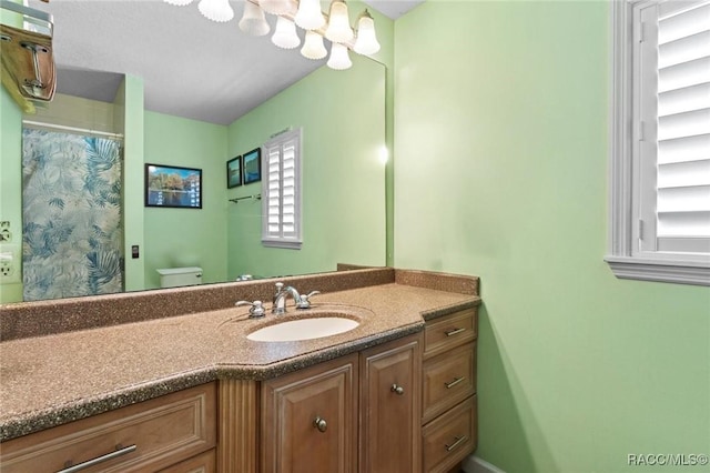 9885 E Lindale Ct, Inverness, FL 34450 - full bathroom featuring toilet, vanity, and curtained shower
