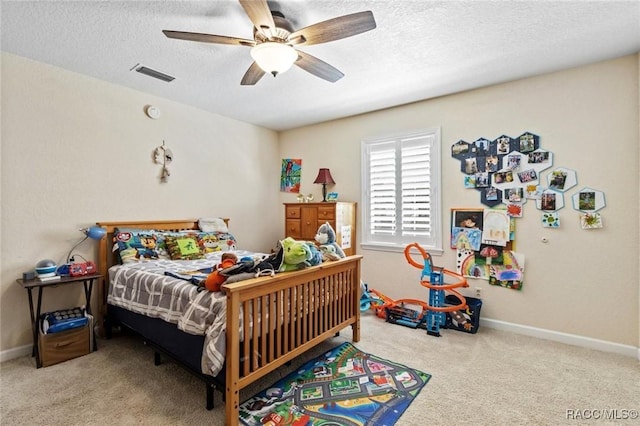 9885 E Lindale Ct, Inverness, FL 34450 - bedroom featuring carpet, a textured ceiling, ceiling fan, and baseboards